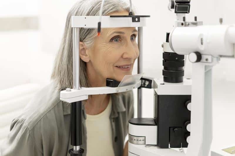 A woman undergoing an eye exam in Fort Myers, FL